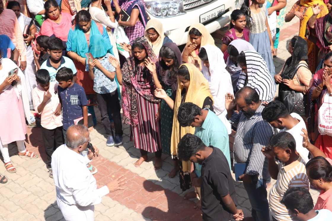 water baptism given by pastor to church believer